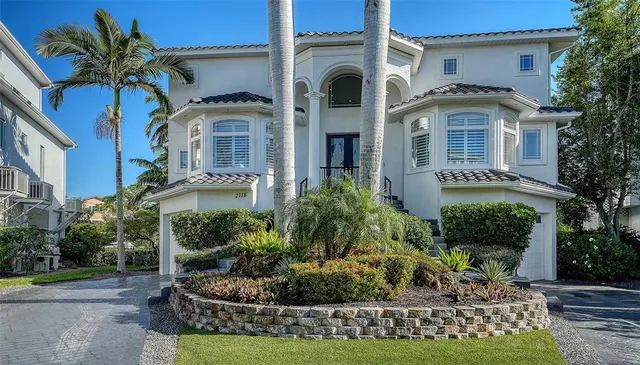 a front view of a house with garden