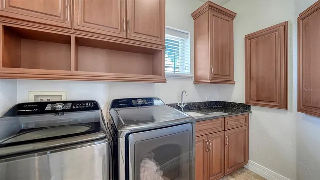 a living room with fireplace furniture and a flat screen tv