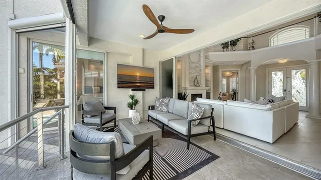 a spacious bedroom with a bed and a flat screen tv