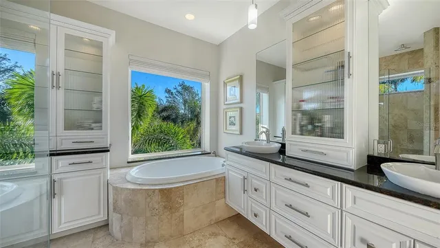 a bedroom with furniture and a flat screen tv
