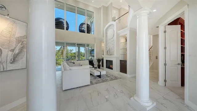 a living room with white walls and white furniture