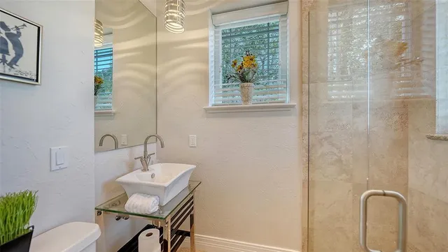 a view of swimming pool with a patio and a garden