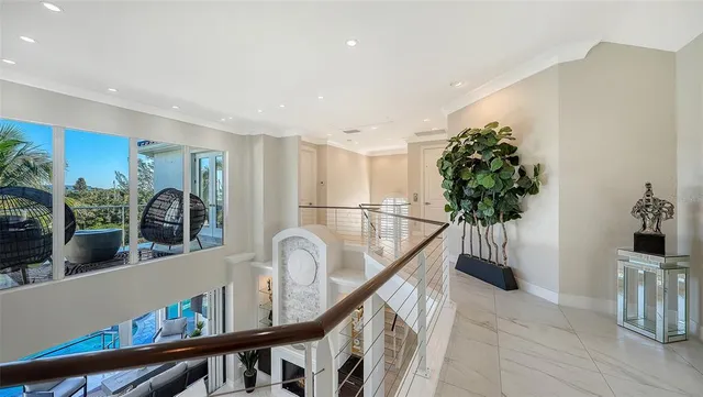 a view of a house with a yard and palm trees