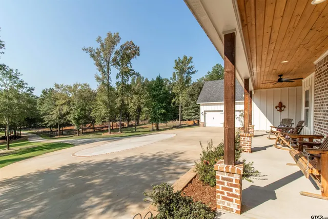 a living room with furniture fireplace and wooden floor