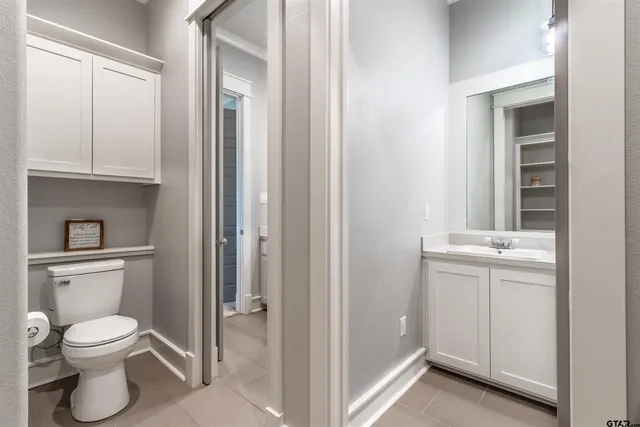 a bedroom with a bed and flat screen tv