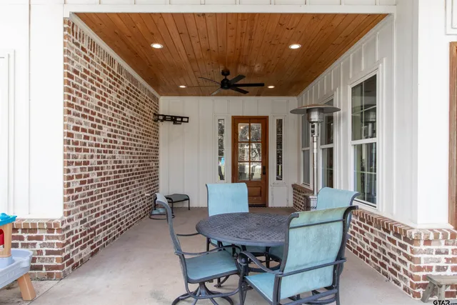 a view of a house with swimming pool and a yard