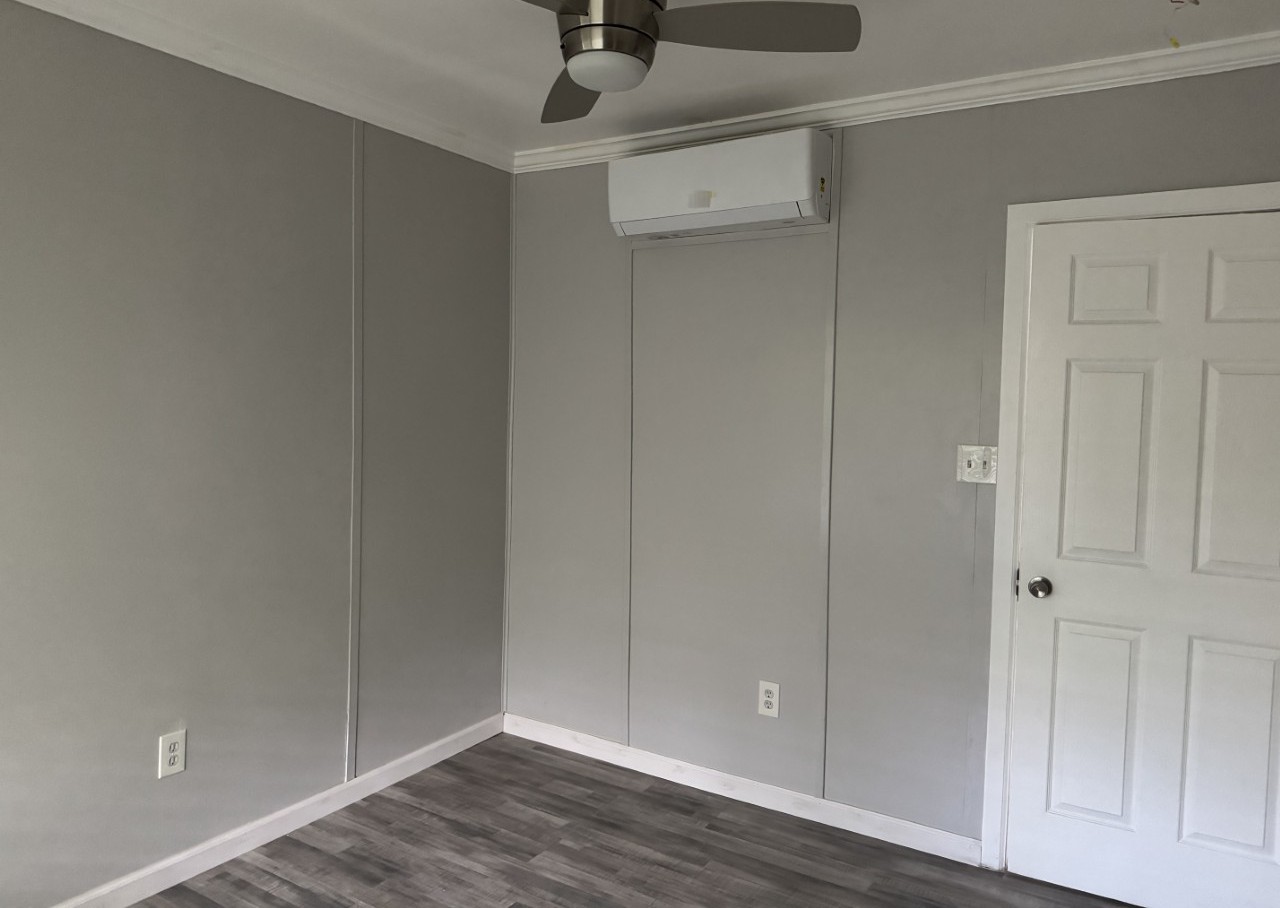 1813 Rhodes Road Austin, TX 78721 - Photo 7 of 14 A well-lit room featuring durable flooring and a streamlined cooling system for ultimate comfort.