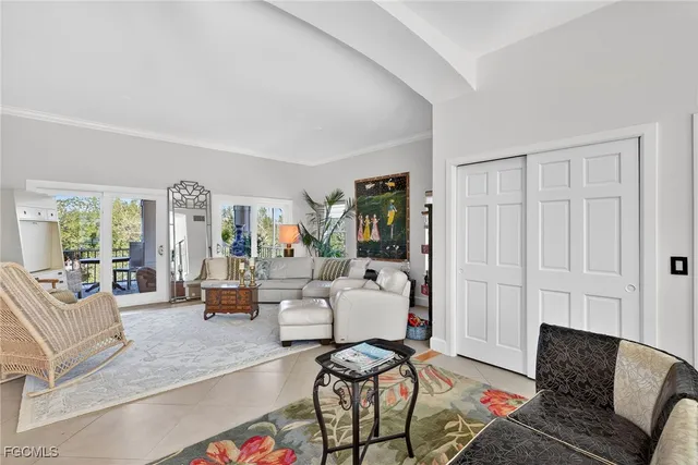 a living room with furniture or couch and a large window