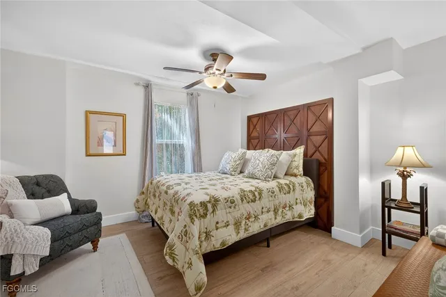 a bed room with a bed and a chandelier