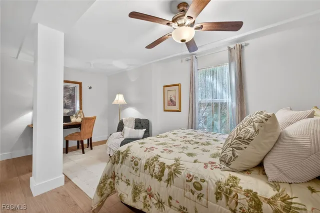 a bathroom with a granite countertop toilet sink and mirror