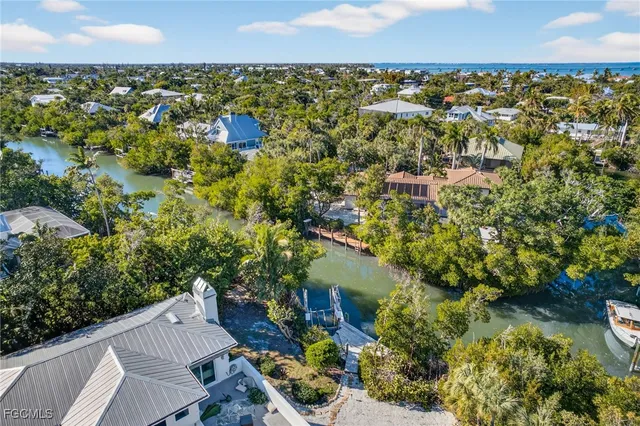 a aerial view of a house with a yard