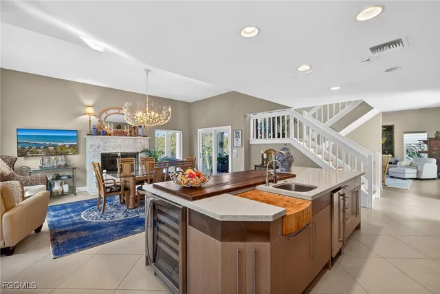 a view of living room filled with furniture and fireplace
