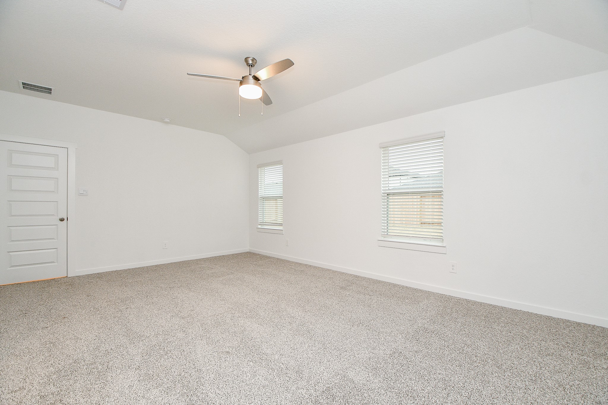 31715 Hallington Hl Lane Fulshear, TX 77441 - Photo 14 of 37 an empty room with windows and fan