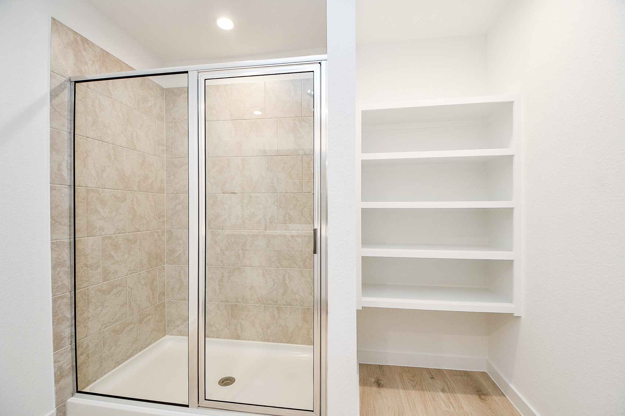 31715 Hallington Hl Lane Fulshear, TX 77441 - Photo 18 of 37 a bathroom with a glass shower door