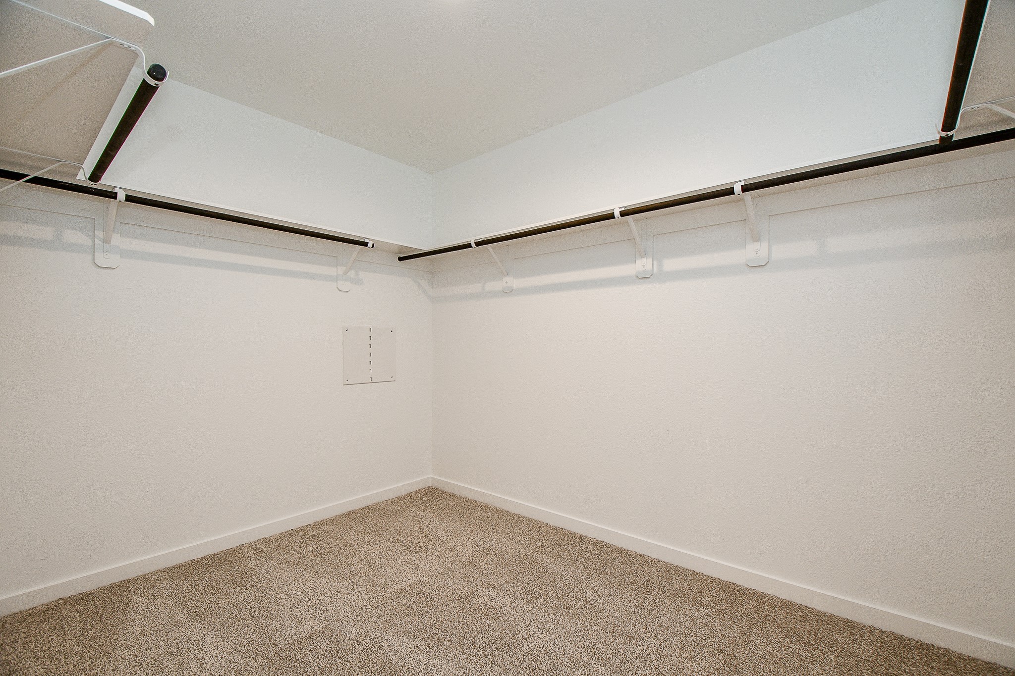 31715 Hallington Hl Lane Fulshear, TX 77441 - Photo 19 of 37 a view of a room with racks on the wall