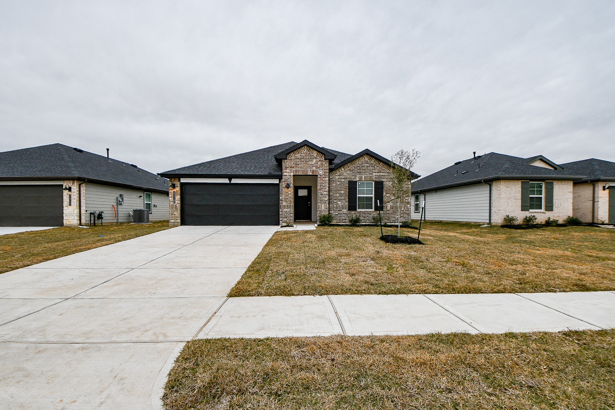 31715 Hallington Hl Lane Fulshear, TX 77441 - Photo 2 of 37 a front view of a house with garage