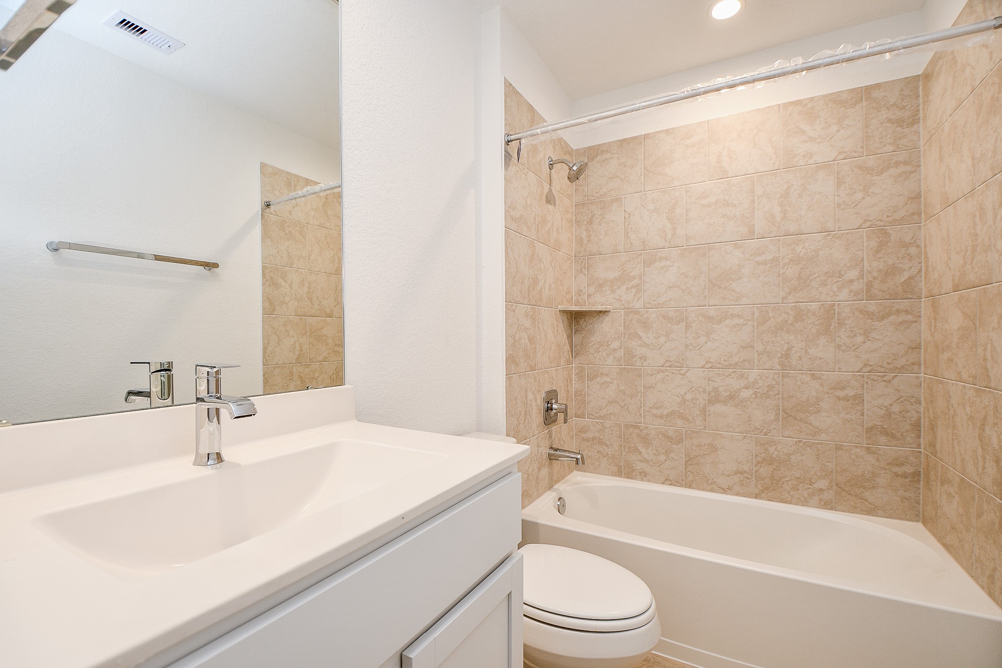 31715 Hallington Hl Lane Fulshear, TX 77441 - Photo 28 of 37 a bathroom with a sink a toilet and a bathtub