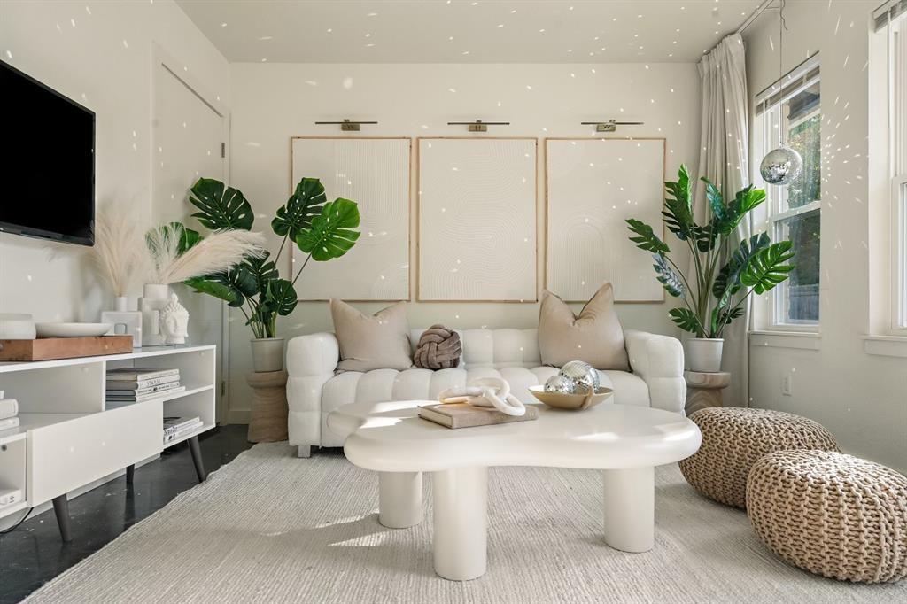 6003 Jain Lane, Unit A Austin, TX 78721 - Photo 2 of 15 a living room with furniture potted plant and a mirror