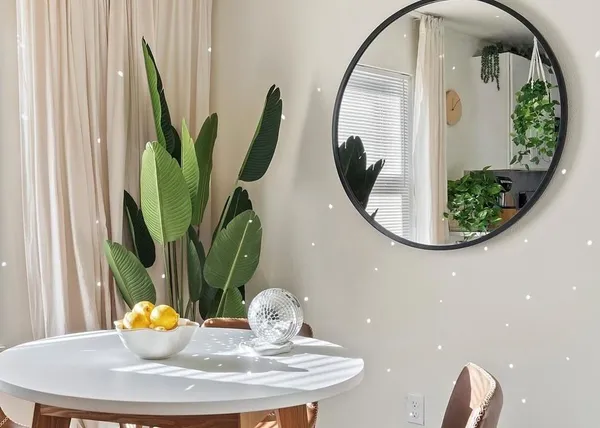 a bathroom with a mirror sink and a mirror