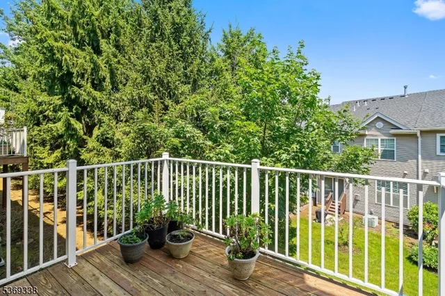 a deck with a table and chairs