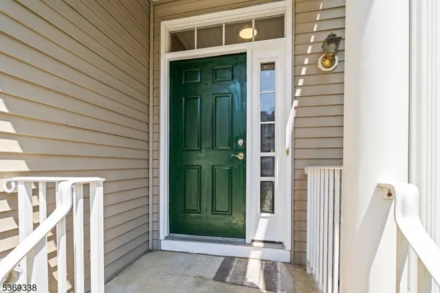 a view of a brick house with a green space