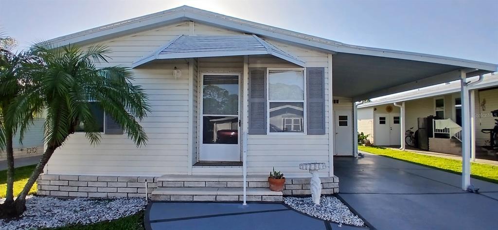 a view of the house with a patio