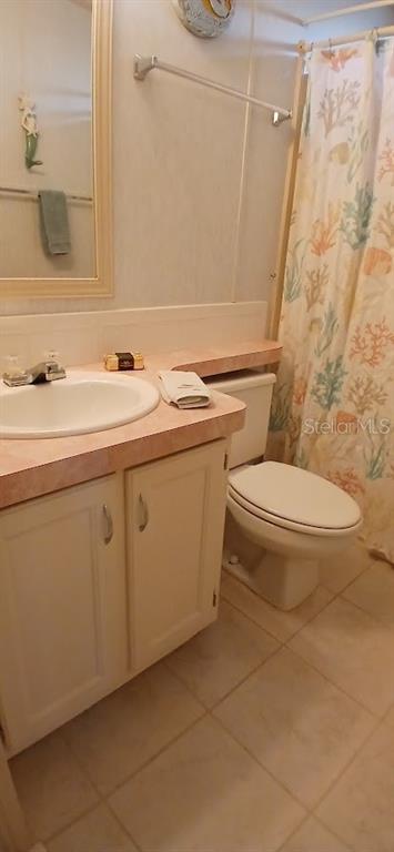 278 Pine Loop Frostproof, FL 33843 - Photo 21 of 40 a bathroom with a sink a toilet and mirror