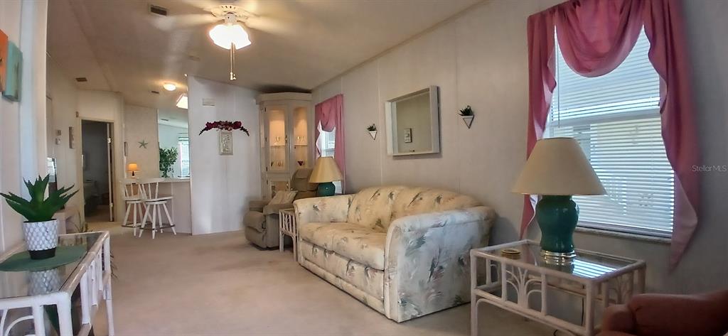 278 Pine Loop Frostproof, FL 33843 - Photo 27 of 40 a bed room with a bed and a lamp