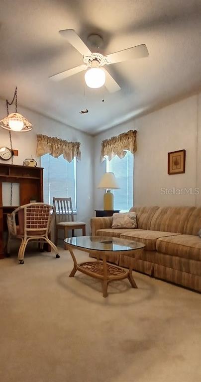 278 Pine Loop Frostproof, FL 33843 - Photo 29 of 40 a living room with furniture gym equipment and a large window