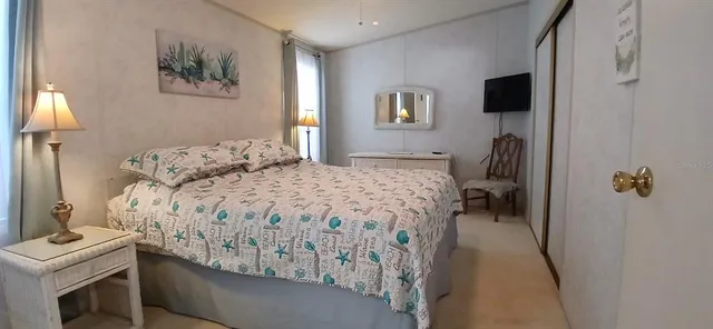 a bedroom with a bed and a sink