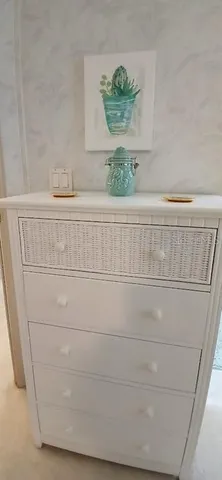a bathroom with a double vanity sink and a toilet