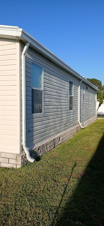 278 Pine Loop Frostproof, FL 33843 - Photo 6 of 40 a front view of a house with garden