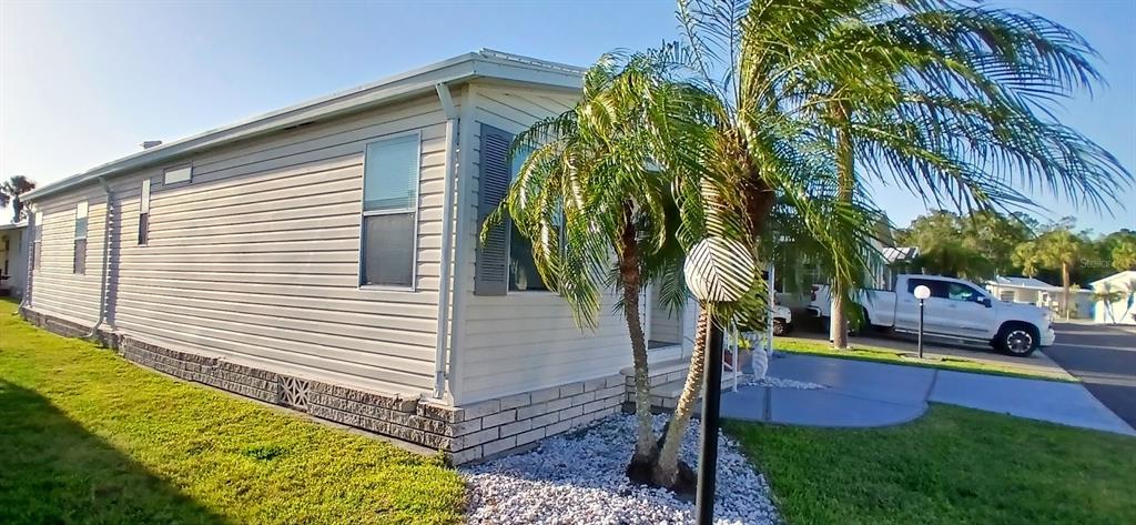 278 Pine Loop Frostproof, FL 33843 - Photo 10 of 40 a view of a backyard with plants and palm tree