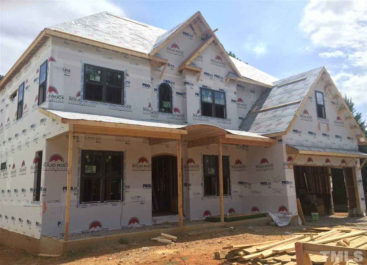 114 Reynolds Road Raleigh, NC 27609 - Photo 1 of 13 a view of a white house with large windows