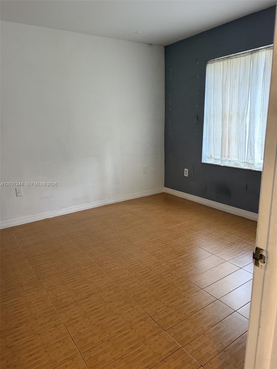 13752 Southwest 156th Street Miami, FL 33177 - Photo 12 of 14 a view of an empty room and window