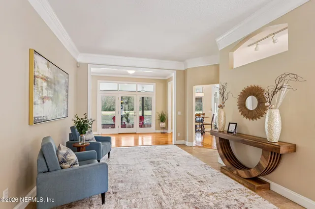 a living room with furniture and a rug