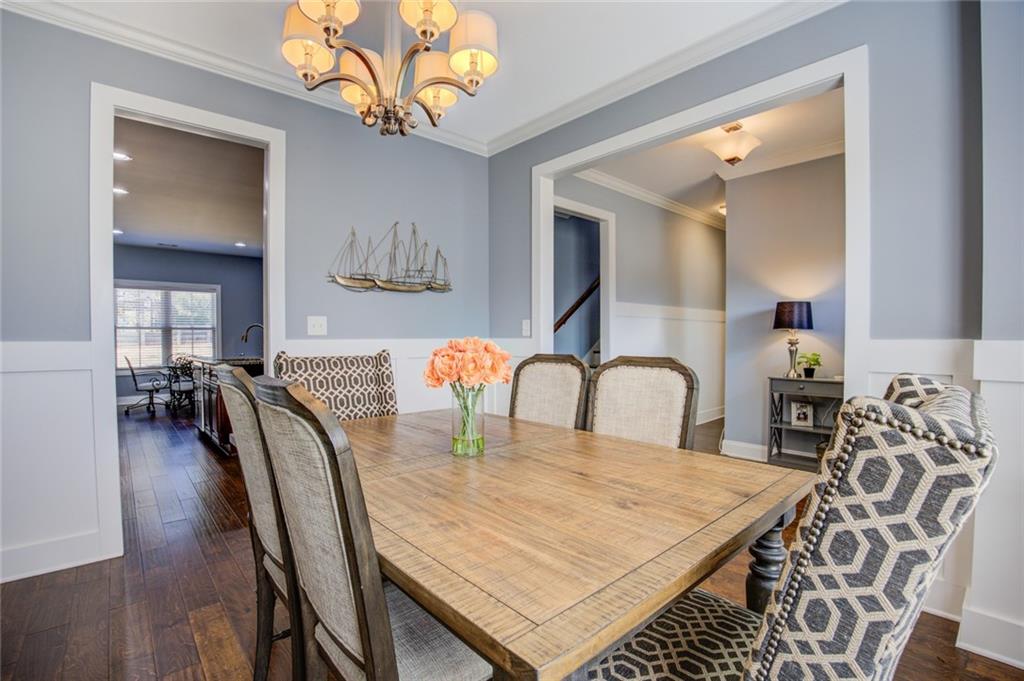 1021 Arbor Court Madison, GA 30650 - Photo 11 of 64 a dining room with furniture and wooden floor