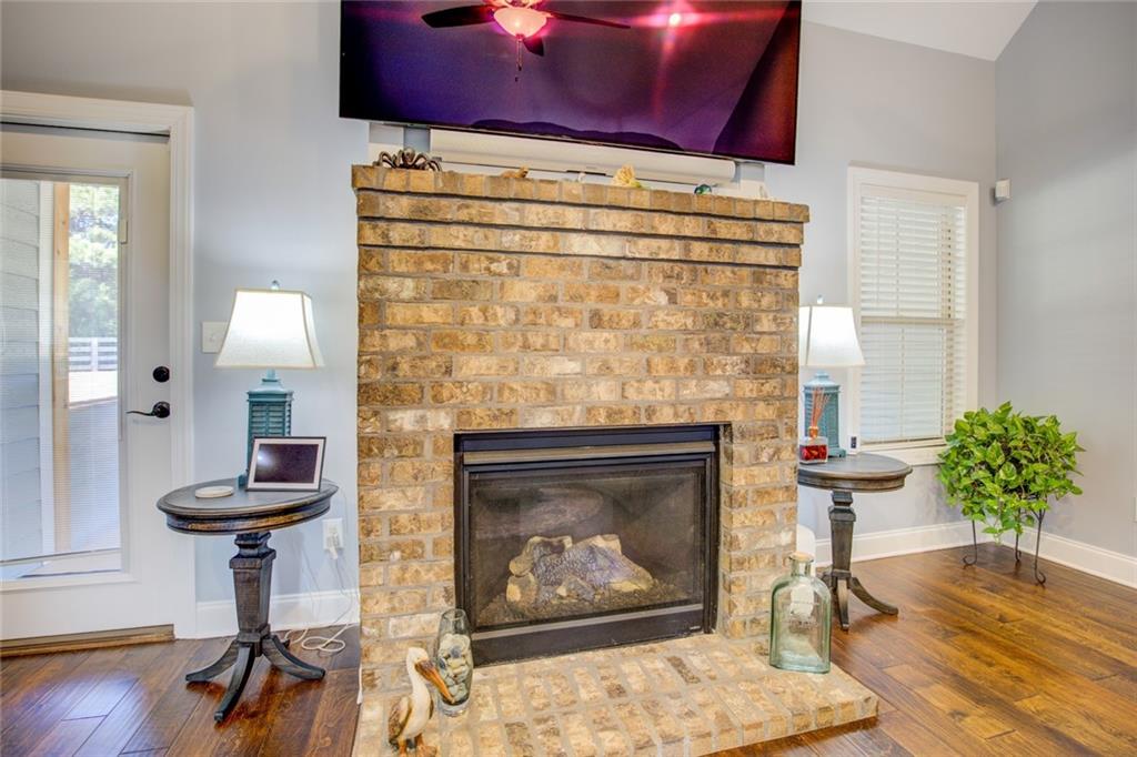1021 Arbor Court Madison, GA 30650 - Photo 16 of 64 a living room with furniture and a fireplace