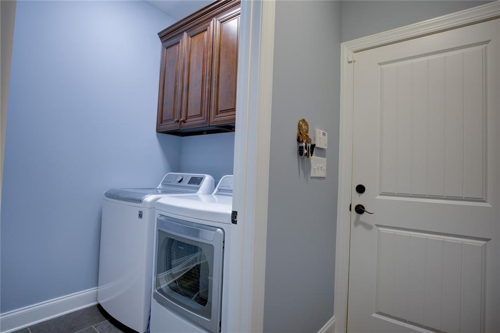 1021 Arbor Court Madison, GA 30650 - Photo 39 of 64 a utility room with dryer and washer