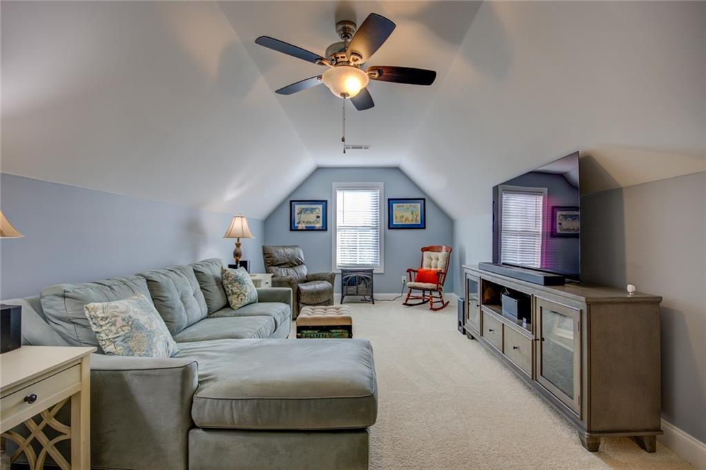 1021 Arbor Court Madison, GA 30650 - Photo 55 of 64 a living room with furniture and a flat screen tv