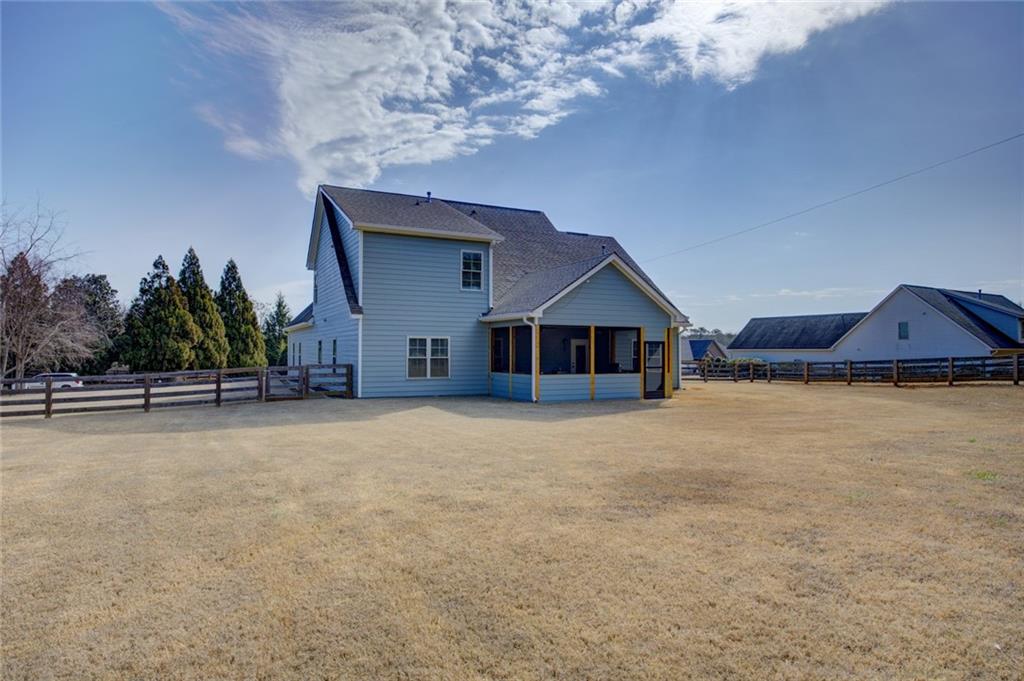 1021 Arbor Court Madison, GA 30650 - Photo 61 of 64 a front view of a house with a yard