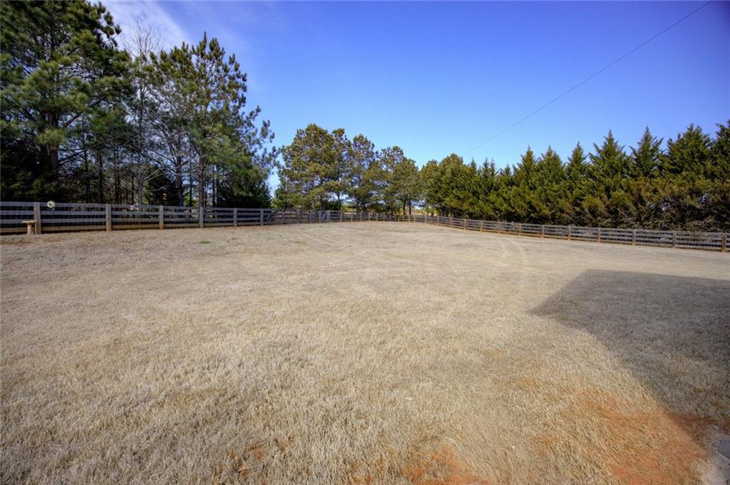 1021 Arbor Court Madison, GA 30650 - Photo 62 of 64 a view of a field with trees in the background