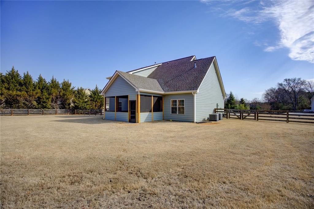 1021 Arbor Court Madison, GA 30650 - Photo 63 of 64 a view of a house with backyard and trees