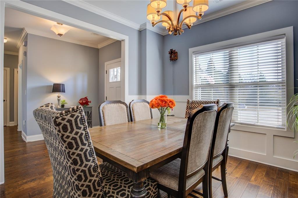 1021 Arbor Court Madison, GA 30650 - Photo 10 of 64 a view of a dining room with furniture window and wooden floor