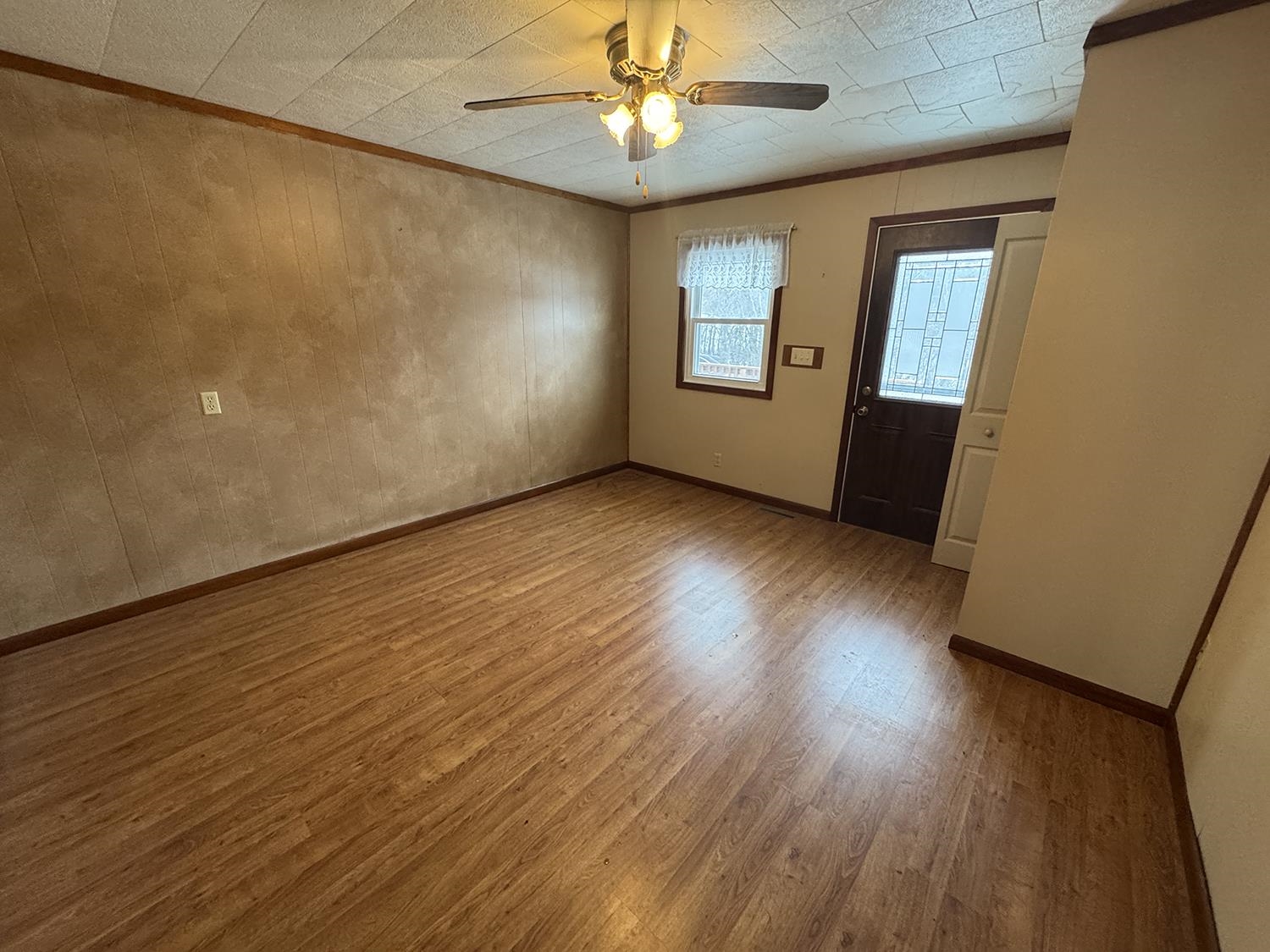 18341 Pleasant Hill Road Mount Carroll, IL 61053 - Photo 16 of 41 wooden floor in an empty room with a window