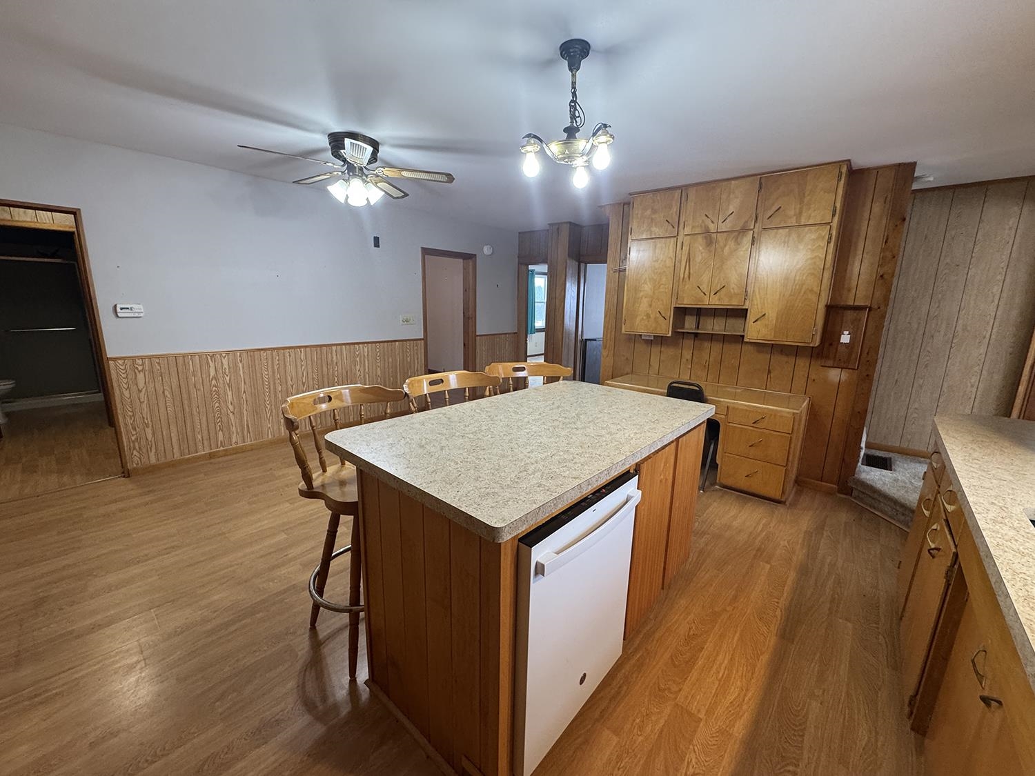 18341 Pleasant Hill Road Mount Carroll, IL 61053 - Photo 22 of 41 a kitchen with a table chairs refrigerator and microwave