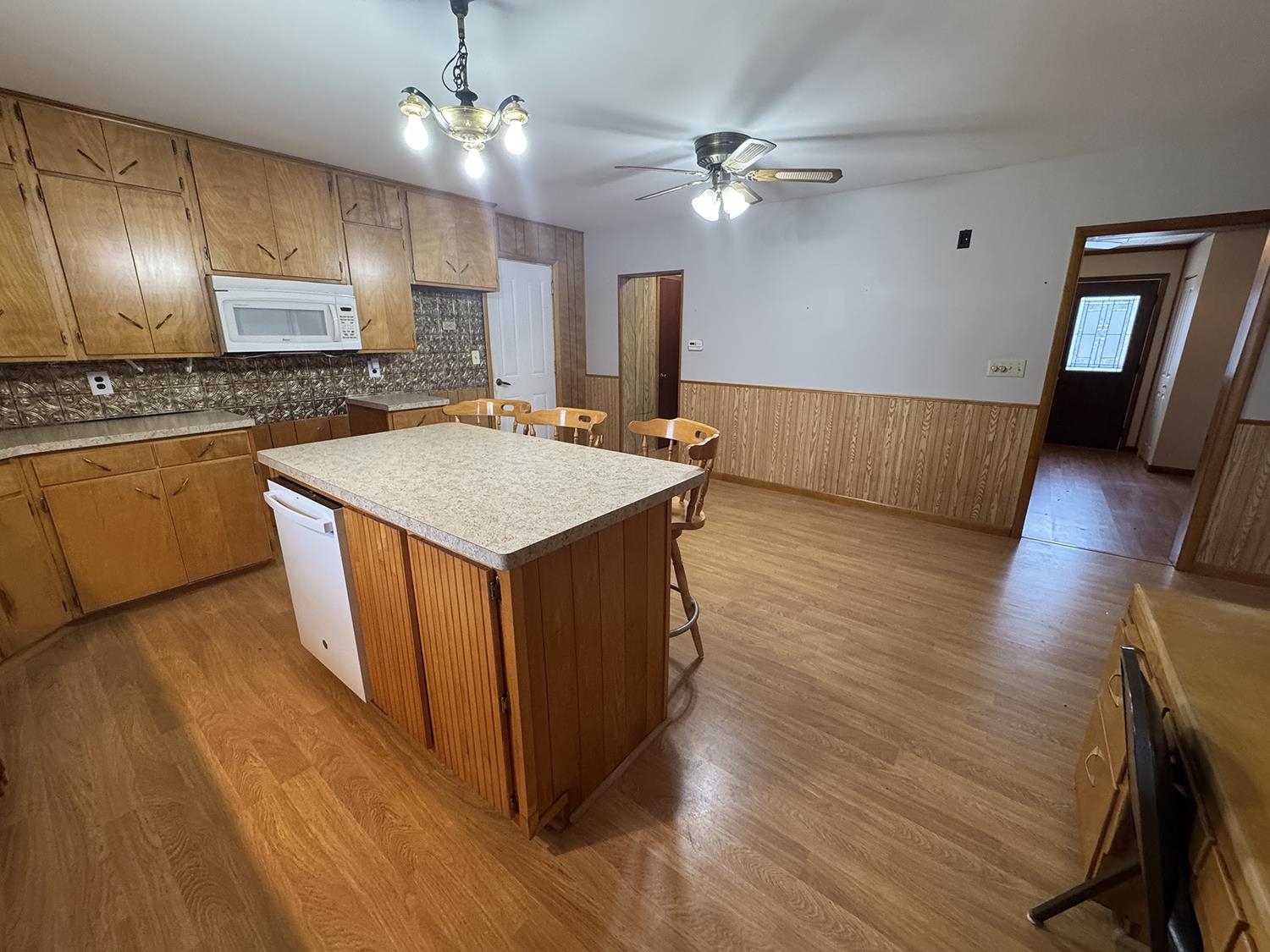 18341 Pleasant Hill Road Mount Carroll, IL 61053 - Photo 23 of 41 a kitchen with wooden floors and refrigerator