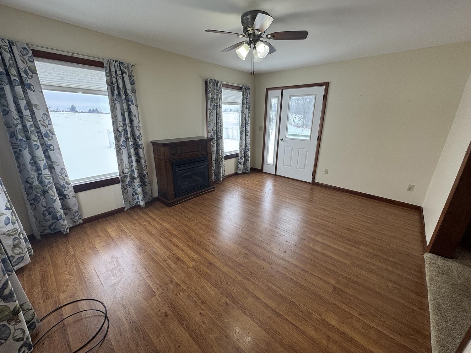 18341 Pleasant Hill Road Mount Carroll, IL 61053 - Photo 24 of 41 a view of empty room with wooden floor and fan