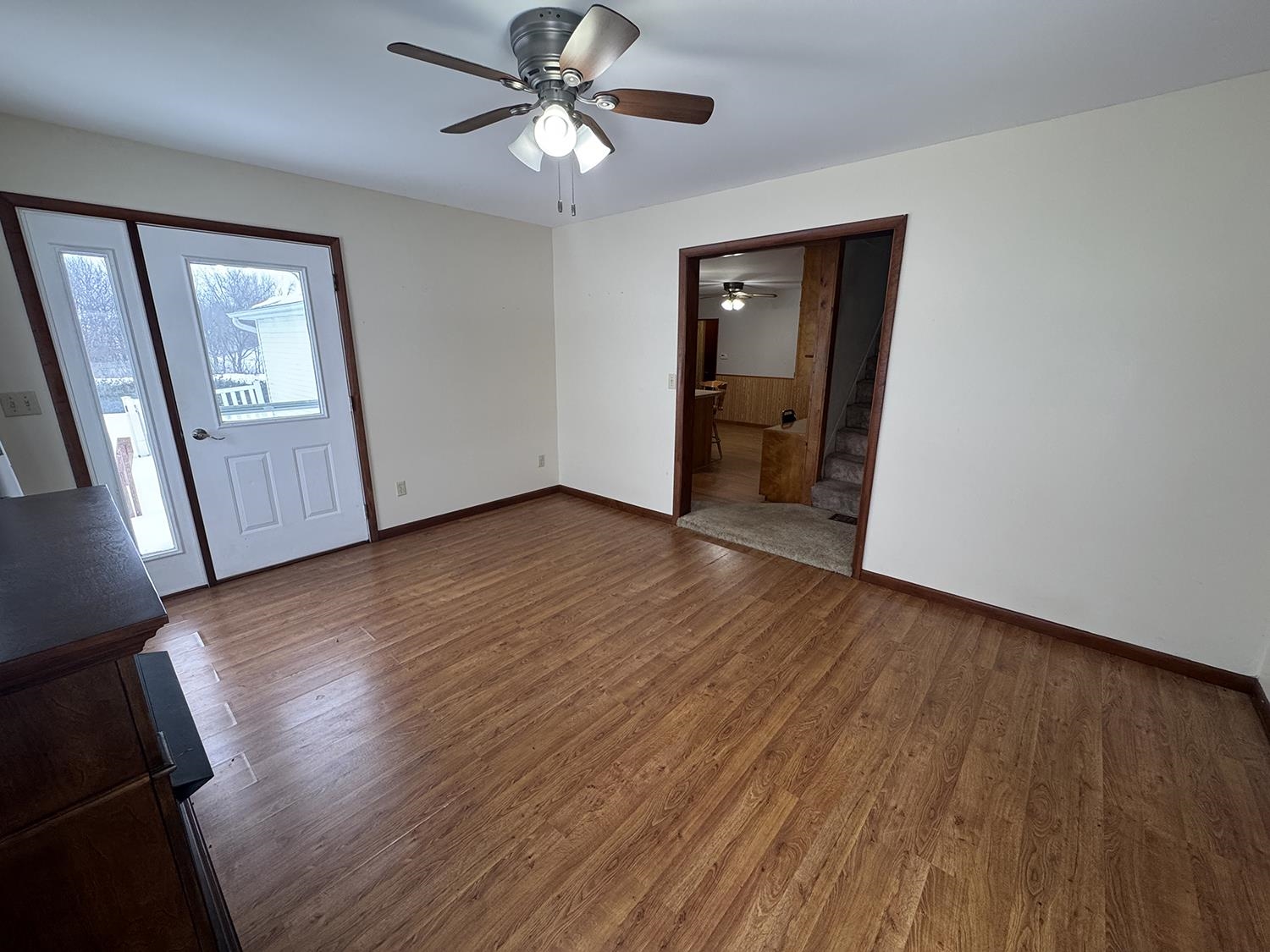18341 Pleasant Hill Road Mount Carroll, IL 61053 - Photo 25 of 41 a view of an empty room with wooden floor and a window