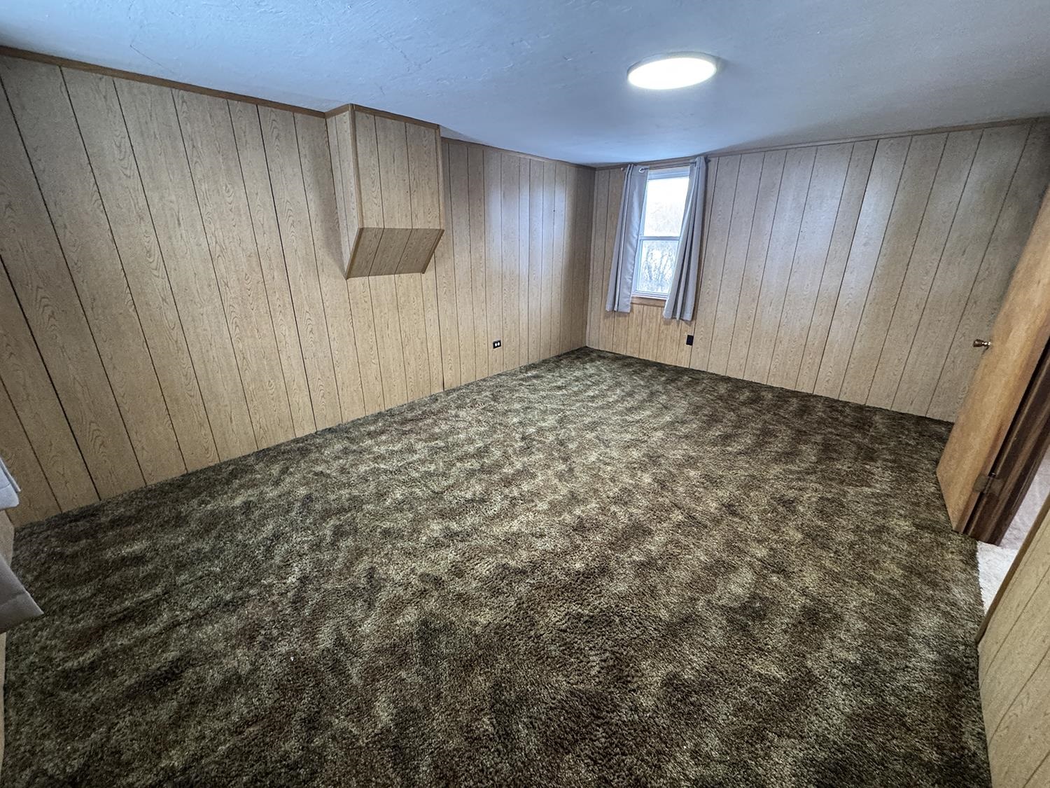 18341 Pleasant Hill Road Mount Carroll, IL 61053 - Photo 30 of 41 a view of an empty room with a window